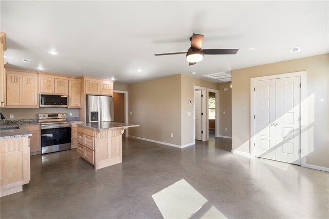 9783 Ar-59, Decatur, AR 72722 - kitchen featuring stainless steel appliances, light brown cabinets, finished concrete floors, baseboards, and a kitchen island
