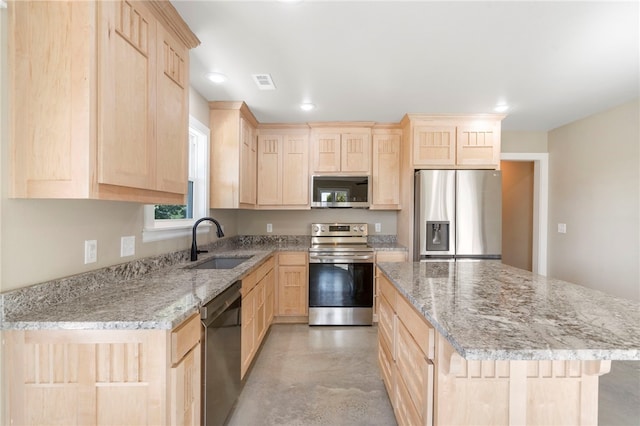 9783 Ar-59, Decatur, AR 72722 - kitchen with light brown cabinets, stainless steel appliances, a sink, concrete flooring, and a kitchen island