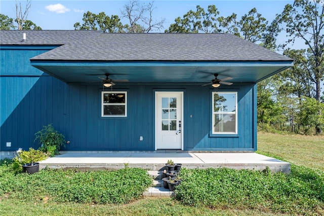9783 Ar-59, Decatur, AR 72722 - doorway to property featuring a ceiling fan, roof with shingles, and a patio
