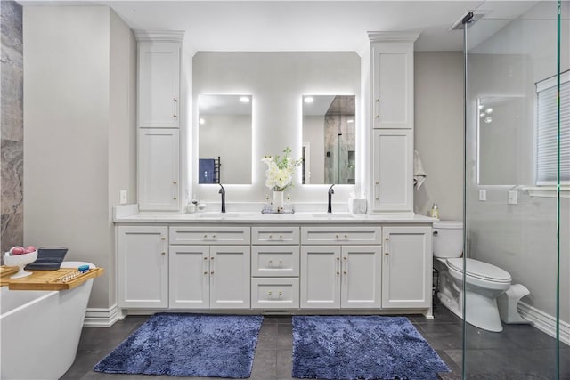 14156 Rolling Hills Dr, Bentonville, AR 72712 - full bathroom with double vanity, a shower stall, a freestanding bath, and baseboards