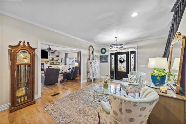 14156 Rolling Hills Dr, Bentonville, AR 72712 - living room with wood finished floors, a chandelier, crown molding, baseboards, and recessed lighting