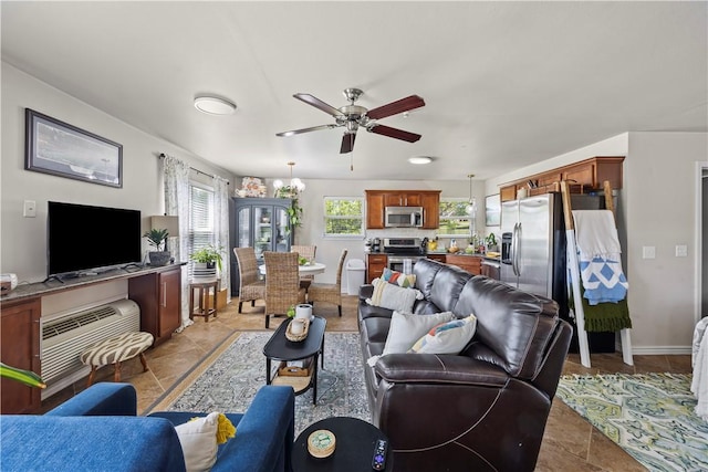 14156 Rolling Hills Dr, Bentonville, AR 72712 - living area featuring a ceiling fan and baseboards