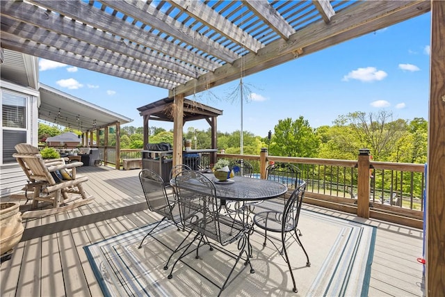 14156 Rolling Hills Dr, Bentonville, AR 72712 - wooden terrace featuring a pergola and outdoor dining area