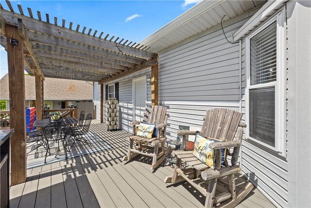 14156 Rolling Hills Dr, Bentonville, AR 72712 - wooden deck featuring a pergola and outdoor dining area