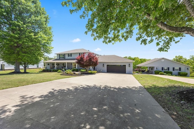 14156 Rolling Hills Dr, Bentonville, AR 72712 - traditional home featuring concrete driveway, a front lawn, and an attached garage