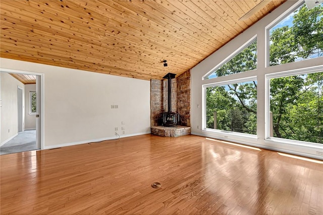 20916 Slate Gap Rd, Garfield, AR 72732 - unfurnished living room with a wood stove, high vaulted ceiling, wood ceiling, hardwood / wood-style flooring, and baseboards