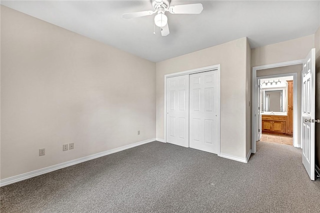 20916 Slate Gap Rd, Garfield, AR 72732 - unfurnished bedroom featuring carpet flooring, baseboards, a closet, and a ceiling fan
