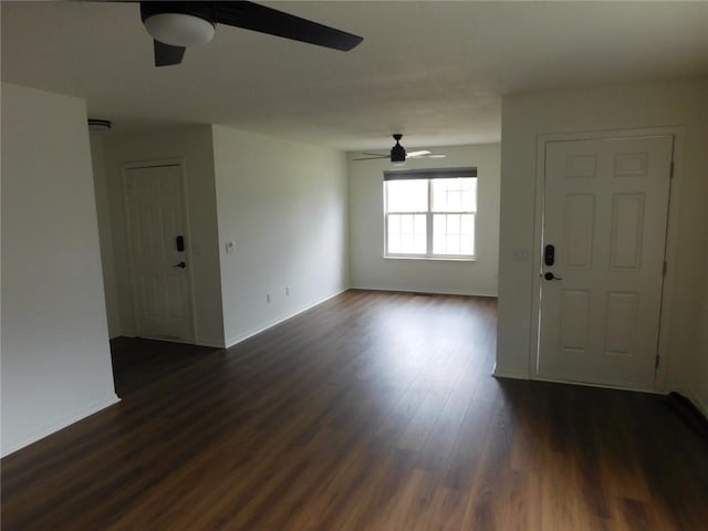 1411 Cresent St, Bentonville, AR 72712 - unfurnished living room featuring ceiling fan, dark wood-type flooring, and baseboards
