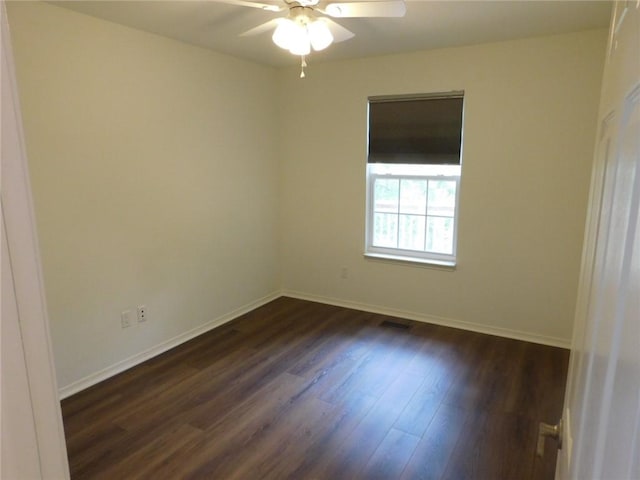1411 Cresent St, Bentonville, AR 72712 - empty room with dark wood-type flooring, baseboards, and a ceiling fan