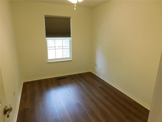 1411 Cresent St, Bentonville, AR 72712 - empty room featuring dark wood-style flooring and baseboards