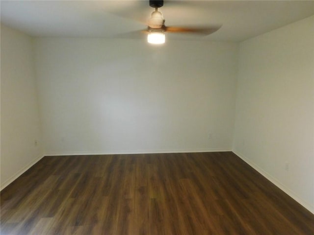 1411 Cresent St, Bentonville, AR 72712 - empty room with a ceiling fan, dark wood-style floors, and baseboards