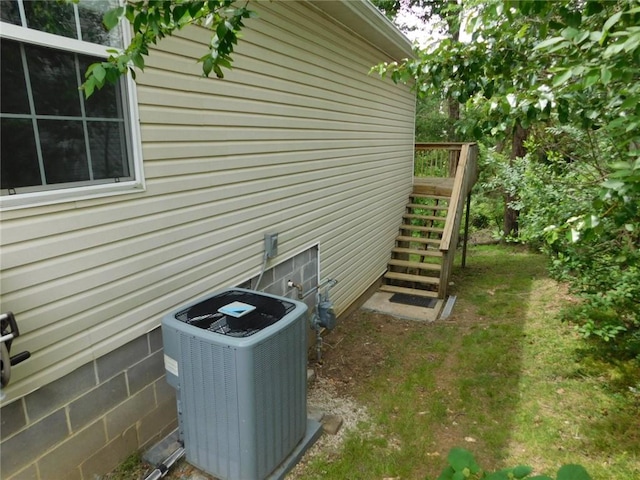 1411 Cresent St, Bentonville, AR 72712 - view of side of property featuring central AC and stairs