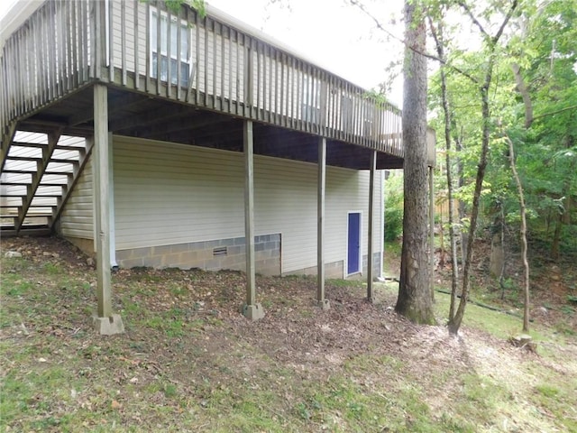 1411 Cresent St, Bentonville, AR 72712 - view of side of property with a deck