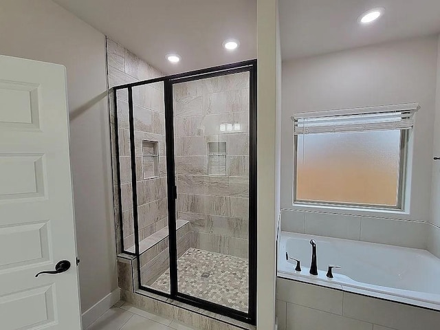 4202 SW Plumley Ave, Bentonville, AR 72713 - full bath featuring a stall shower, a bath, recessed lighting, and tile patterned floors