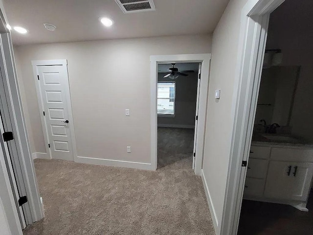 4202 SW Plumley Ave, Bentonville, AR 72713 - hall featuring carpet floors, a sink, baseboards, and recessed lighting