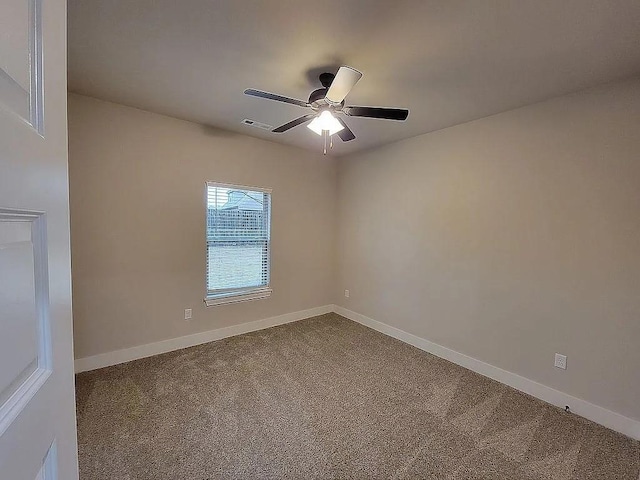 4202 SW Plumley Ave, Bentonville, AR 72713 - spare room featuring dark carpet, ceiling fan, and baseboards