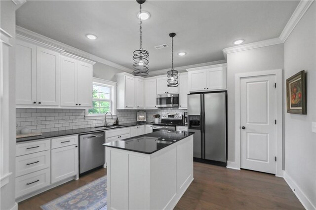 3 Francis Dr, Bella Vista, AR 72715 - kitchen featuring appliances with stainless steel finishes, a sink, crown molding, dark countertops, and white cabinetry