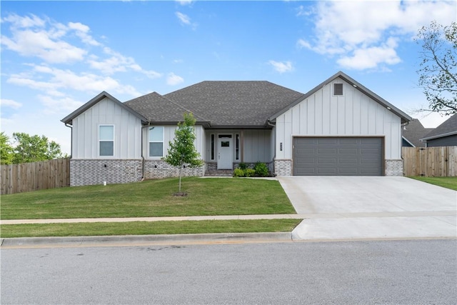 view of front of property with an attached garage, board and batten siding, concrete driveway, and a shingled roof
