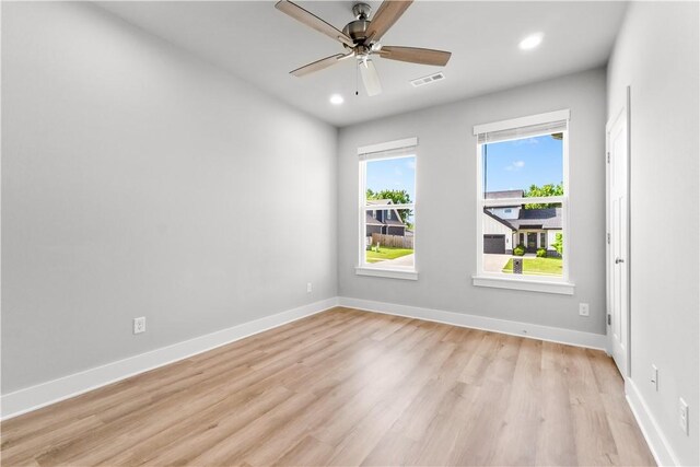 unfurnished room featuring light wood-style floors, recessed lighting, ceiling fan, and baseboards