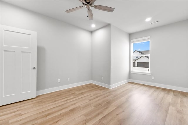 empty room with light wood finished floors, baseboards, ceiling fan, and recessed lighting