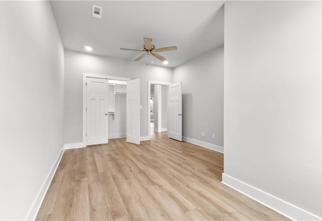 unfurnished bedroom with light wood-style flooring, baseboards, recessed lighting, a ceiling fan, and a closet