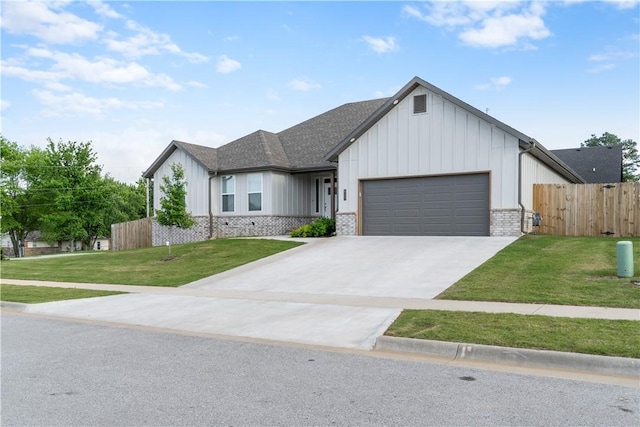 view of front of house with a garage, board and batten siding, concrete driveway, and roof with shingles