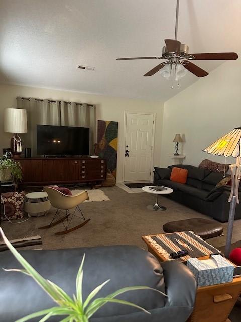 carpeted living room with ceiling fan