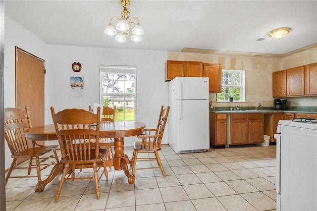 1014 Alma Ave, Mulberry, AR 72947 - dining space with light tile patterned floors and a chandelier