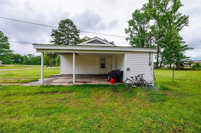 1014 Alma Ave, Mulberry, AR 72947 - view of outdoor structure featuring an attached carport