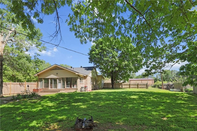 view of yard featuring a sunroom