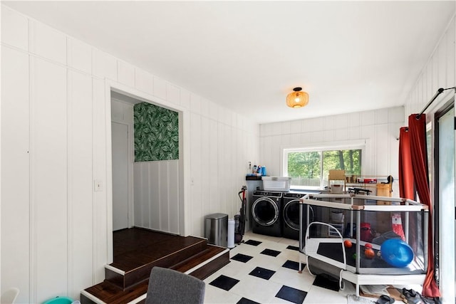 2711 Aspen Ln, Rogers, AR 72758 - washroom with independent washer and dryer, light flooring, and a decorative wall