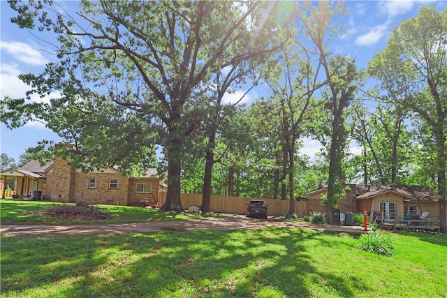 view of yard featuring a wooden deck