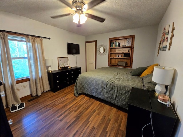 2711 Aspen Ln, Rogers, AR 72758 - bedroom with wood finished floors, a textured ceiling, and ceiling fan