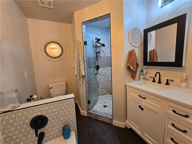 2711 Aspen Ln, Rogers, AR 72758 - full bathroom featuring a stall shower, wood finished floors, and vanity