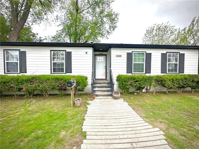1213 Crutcher St, Springdale, AR 72764 - view of front of home with a front yard and entry steps
