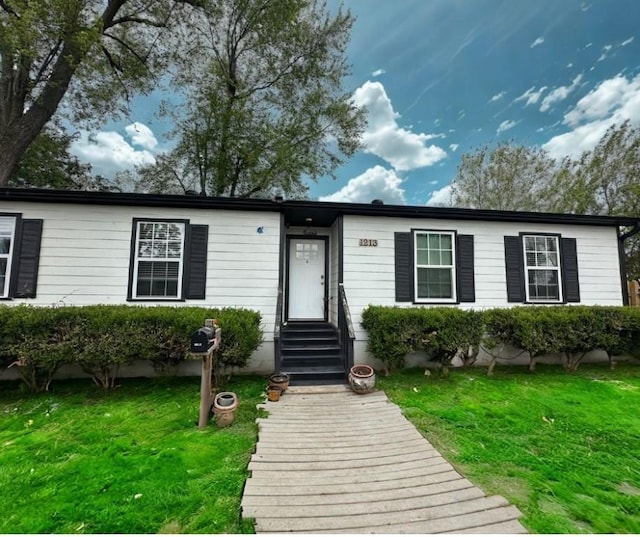 1213 Crutcher St, Springdale, AR 72764 - view of front facade featuring a front yard and entry steps