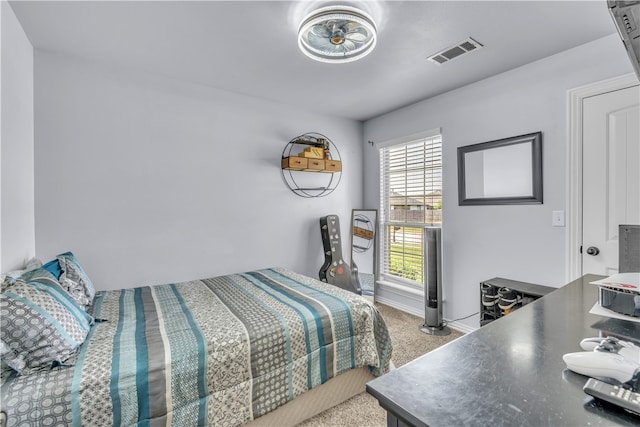 bedroom with carpet flooring and baseboards