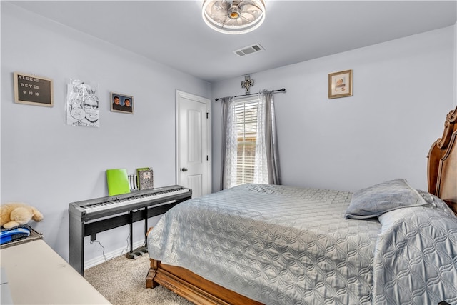 bedroom with carpet floors and baseboards