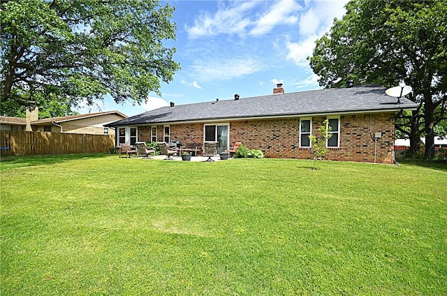 3001 Mcdonald Ave, Springdale, AR 72762 - rear view of house featuring brick siding, a chimney, and a patio