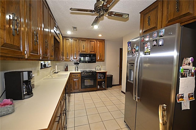 3001 Mcdonald Ave, Springdale, AR 72762 - kitchen with black appliances, a sink, ceiling fan, light countertops, and a textured ceiling
