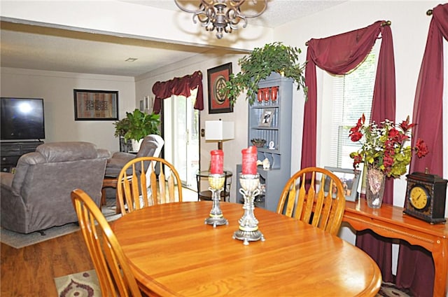 3001 Mcdonald Ave, Springdale, AR 72762 - dining room with a chandelier and wood finished floors