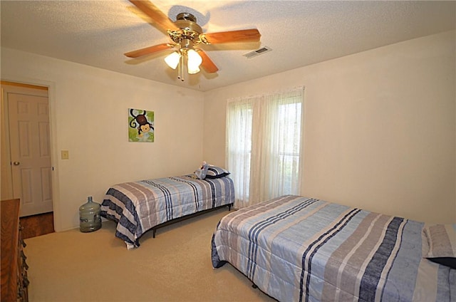 3001 Mcdonald Ave, Springdale, AR 72762 - carpeted bedroom featuring ceiling fan and a textured ceiling