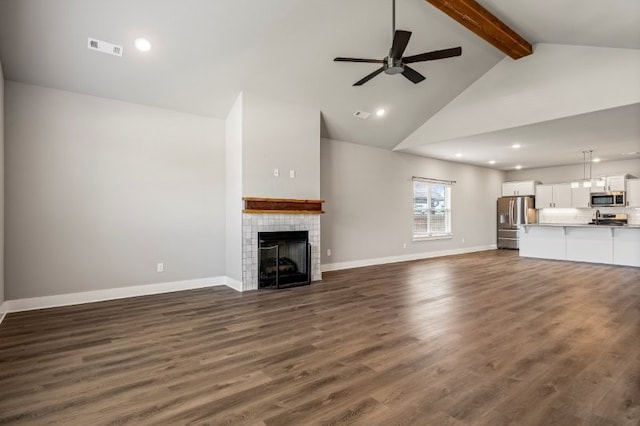4400 SW Pawhuska St, Bentonville, AR 72713 - unfurnished living room featuring beamed ceiling, ceiling fan, a tile fireplace, high vaulted ceiling, and baseboards