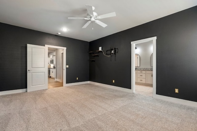 4400 SW Pawhuska St, Bentonville, AR 72713 - unfurnished bedroom with light colored carpet, baseboards, ensuite bathroom, and a ceiling fan