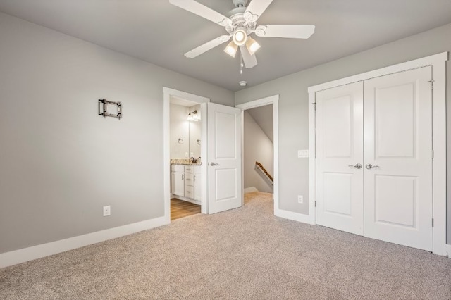 4400 SW Pawhuska St, Bentonville, AR 72713 - unfurnished bedroom featuring light colored carpet, a closet, baseboards, connected bathroom, and ceiling fan