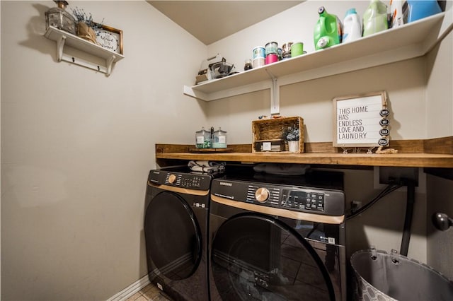 laundry room with separate washer and dryer and baseboards
