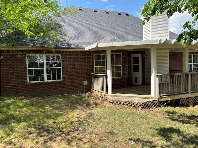 5095 Saxon St, Springdale, AR 72764 - back of house with brick siding, roof with shingles, a chimney, a yard, and a wooden deck