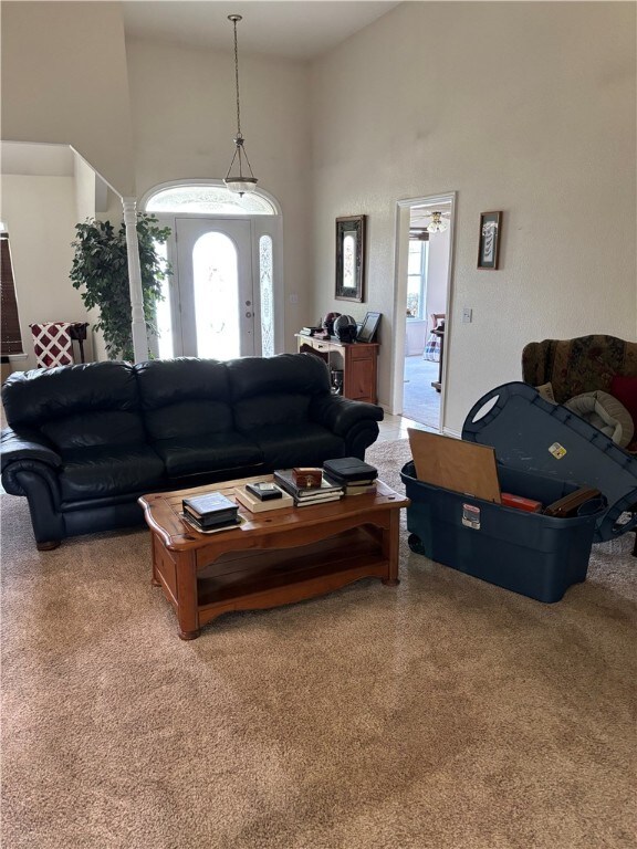 5095 Saxon St, Springdale, AR 72764 - living area with carpet and a high ceiling