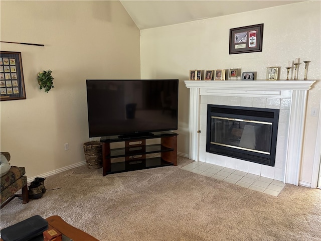 5095 Saxon St, Springdale, AR 72764 - living area featuring carpet floors, lofted ceiling, a tile fireplace, and baseboards