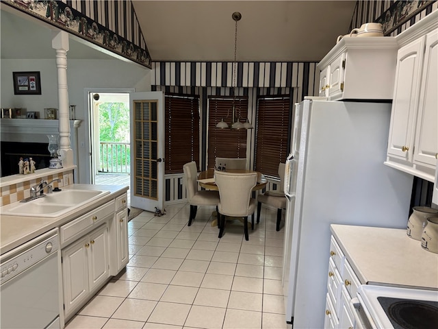 5095 Saxon St, Springdale, AR 72764 - kitchen with white appliances, a sink, white cabinets, light tile patterned floors, and vaulted ceiling